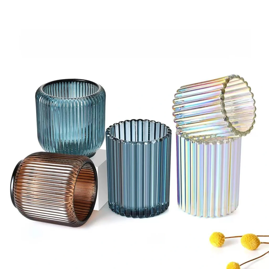 Ribbed glass candle jars in blue, brown and iridescent custom finishes